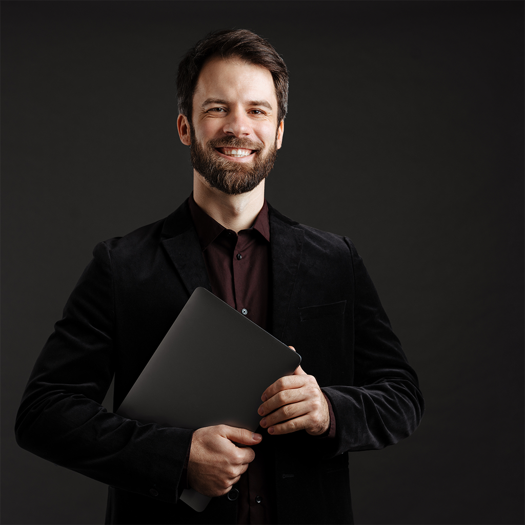 Back angled view with bag open and handles to the side.